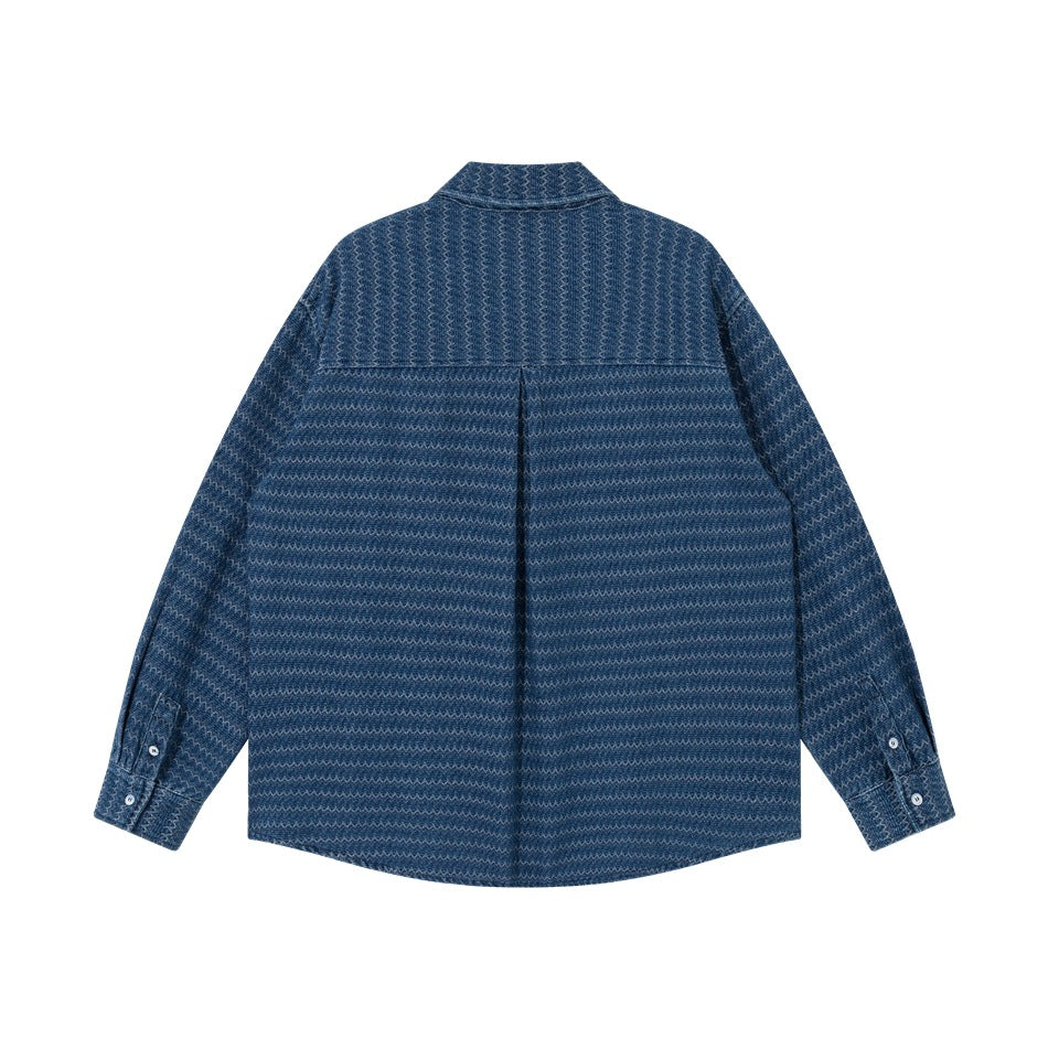 Back view of blue zigzag-textured long-sleeve shirt with back yoke, center pleat and button cuffs