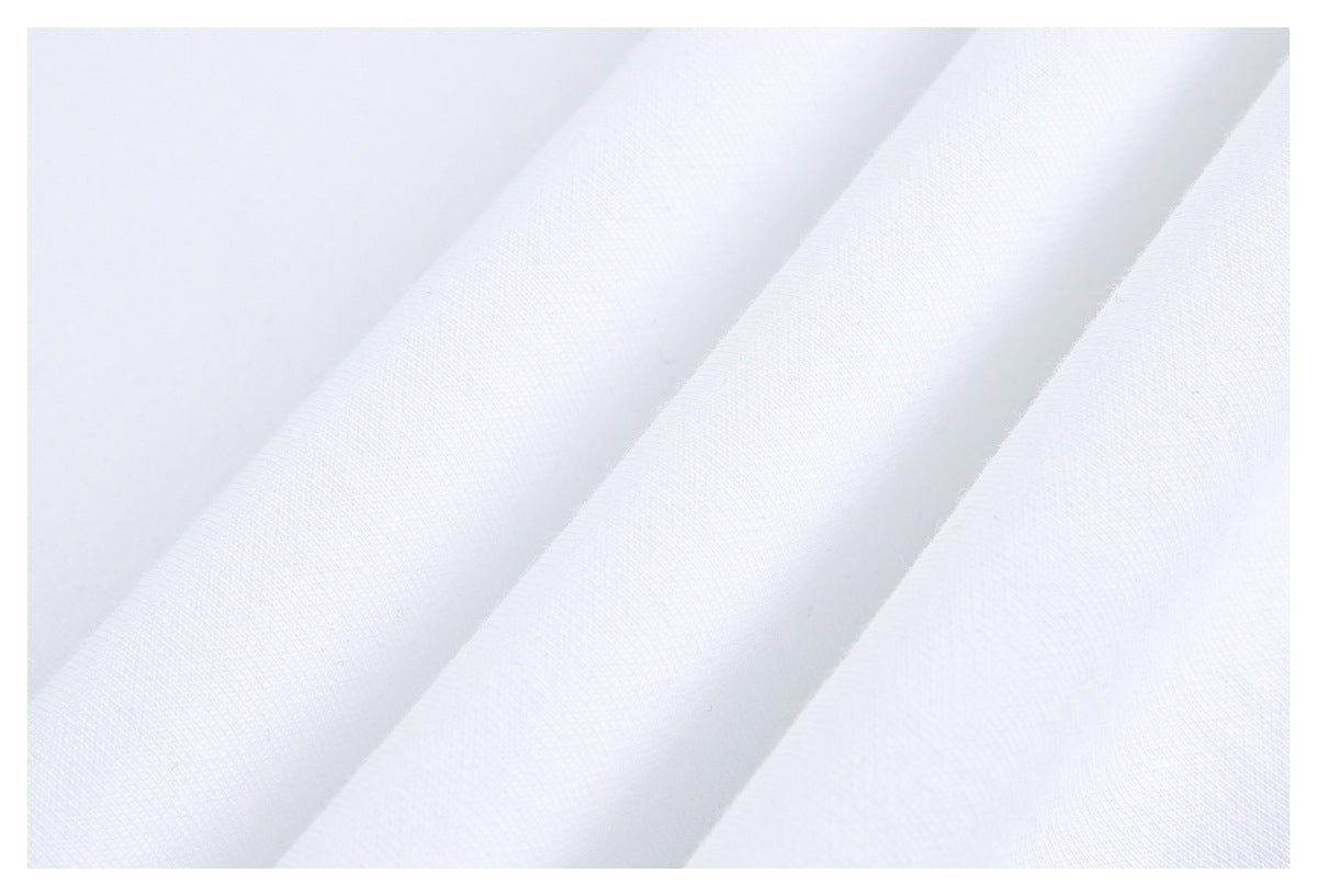 Close-up of white fabric draped in folds, showing its fine knit texture.