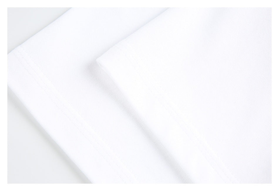 Close-up of a folded edge and stitching on white shirt fabric.