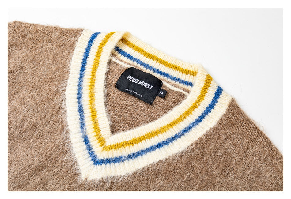 Close-up of the vest's striped V-neck ribbing and sewn-in brand and size labels.