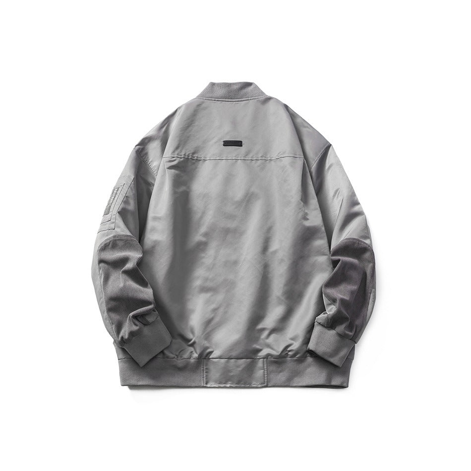 Back view of gray bomber jacket flat lay with ribbed collar and hem, textured sleeve panels and small back label