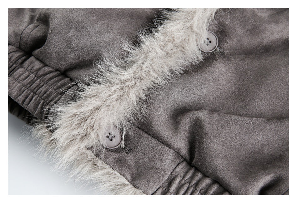 Close-up of a gray coat's pale fur-trimmed front placket, buttons, and gathered cuff.