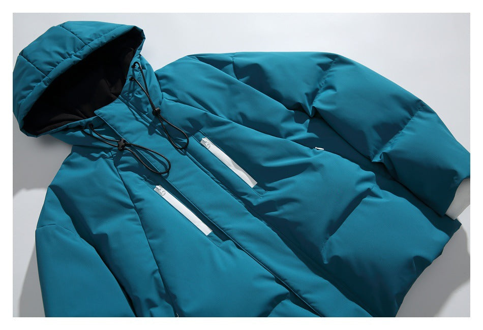 Teal hooded jacket laid flat, with black drawcords, a front closure and two white zip pockets.
