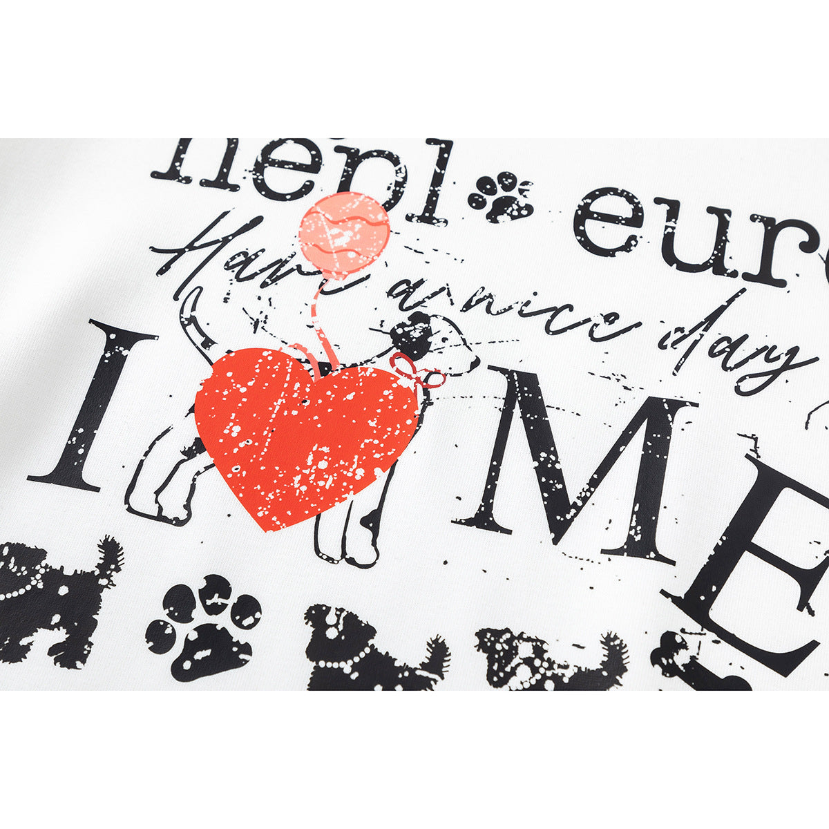 Close-up of a distressed black and red dog-themed graphic printed on a white sweatshirt.