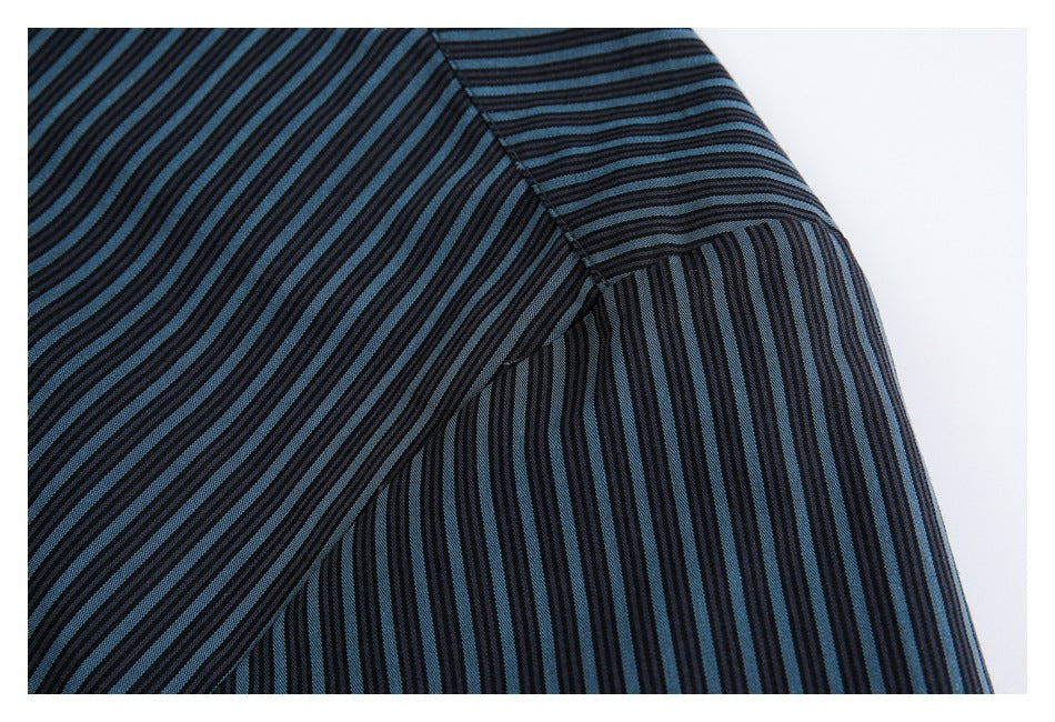 Close-up of a black and blue striped shirt showing the shoulder and sleeve seam.