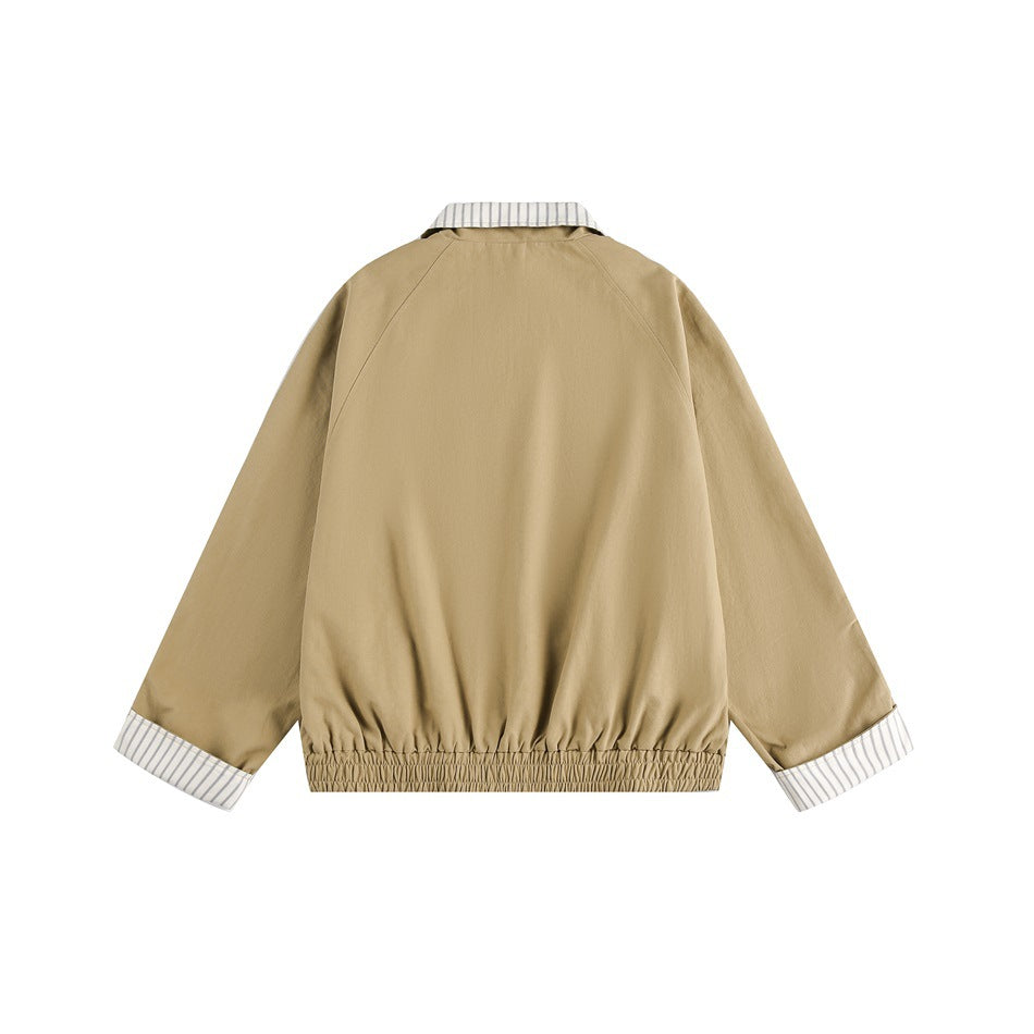 Back view of a tan jacket with raglan sleeves, a gathered hem, and striped collar and cuffs.