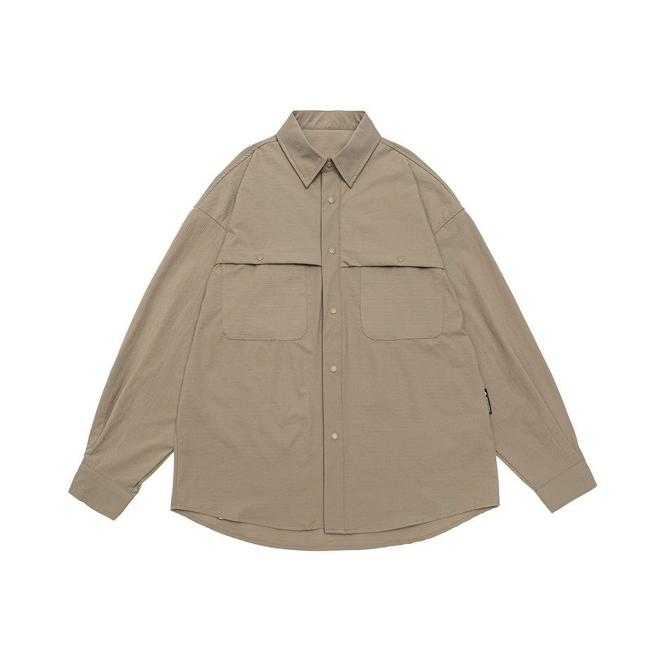 Khaki long-sleeve button-up shirt with two flap chest pockets, flat lay front view
