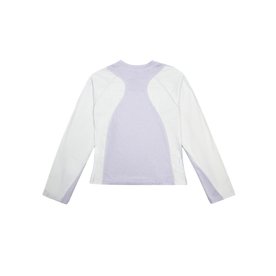 Flat view of a long-sleeve athletic top with a pale lavender center panel and off-white sleeves and sides.