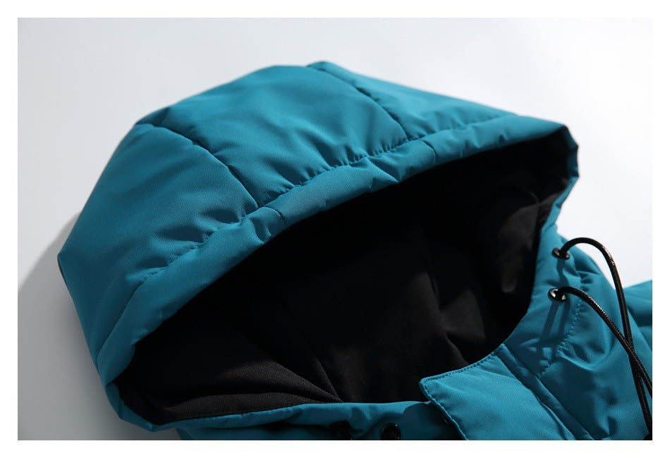 Close-up of the teal jacket's padded hood and black lining.