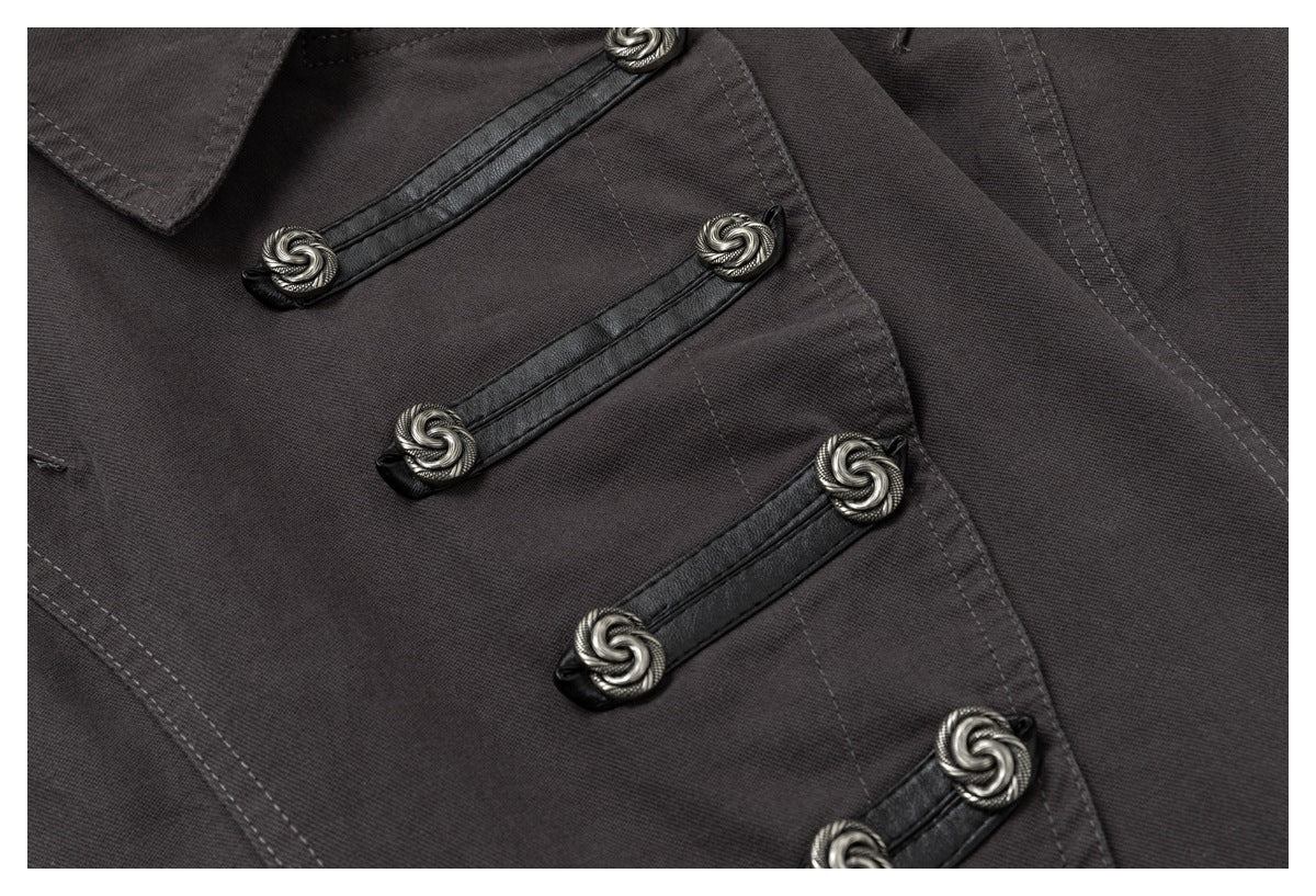 Close-up of the jacket's black-trimmed front fastenings and ornate silver-toned toggle ends.