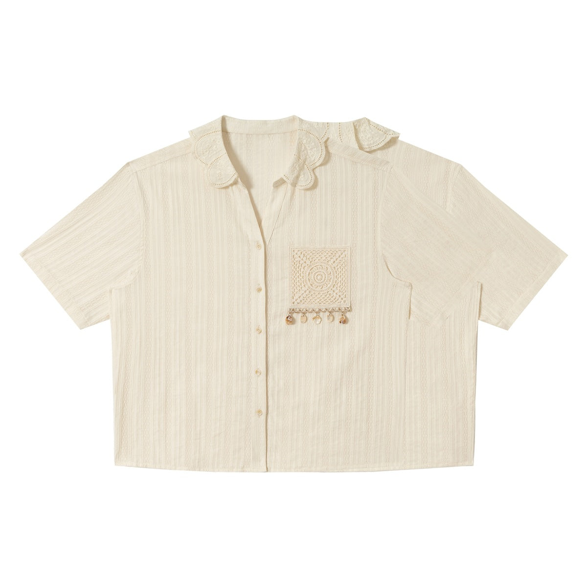 Front view of an ivory short-sleeve button-up shirt with an embroidered scalloped collar and crocheted pocket with dangling