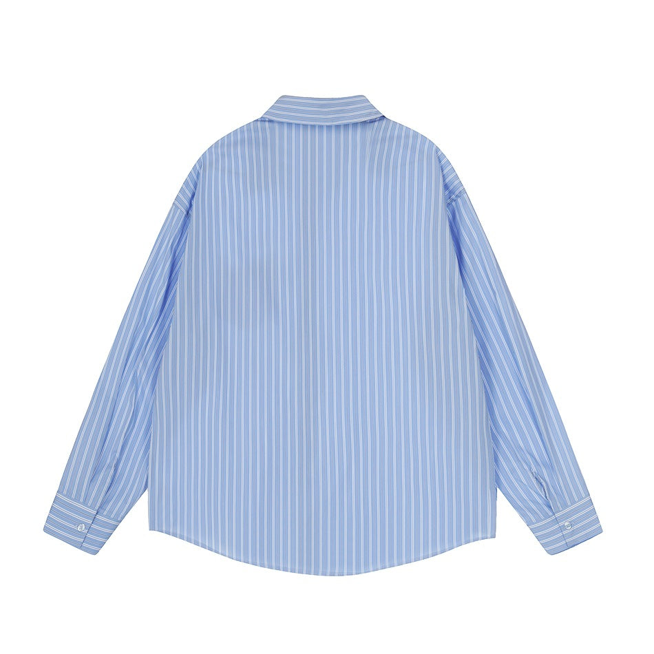 Back view of blue striped long-sleeve button-up shirt with pointed collar and button cuffs, flat lay