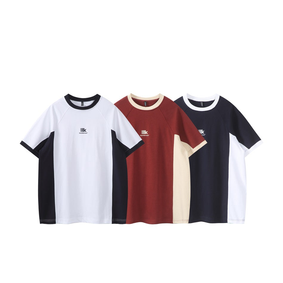 Three short-sleeve color-block shirts shown from the front in white and black, burgundy and cream, and navy and white.
