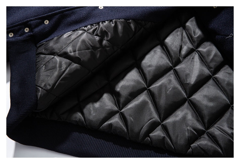 Close-up of the jacket's black diamond-quilted lining and navy ribbed trim.