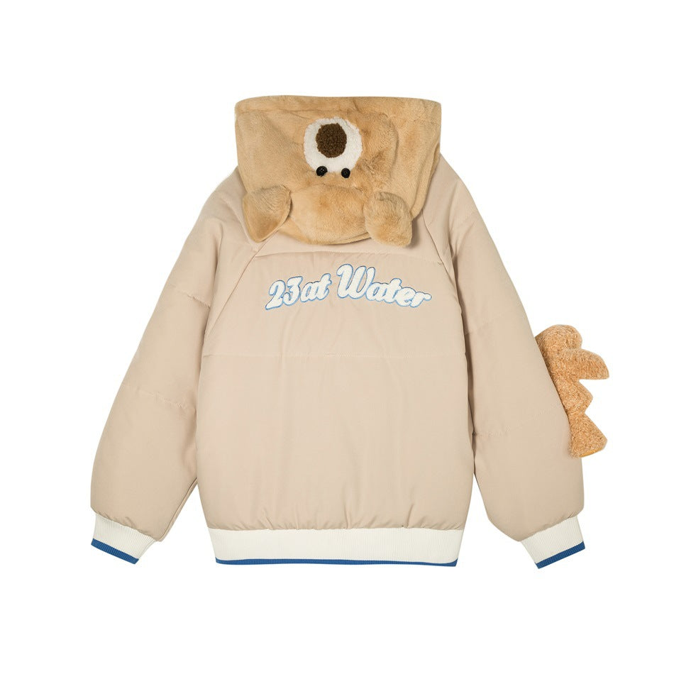 Front view of a beige puffer jacket with a plush bear-face hood, side plush detail, blue-and-white trim and chest lettering.