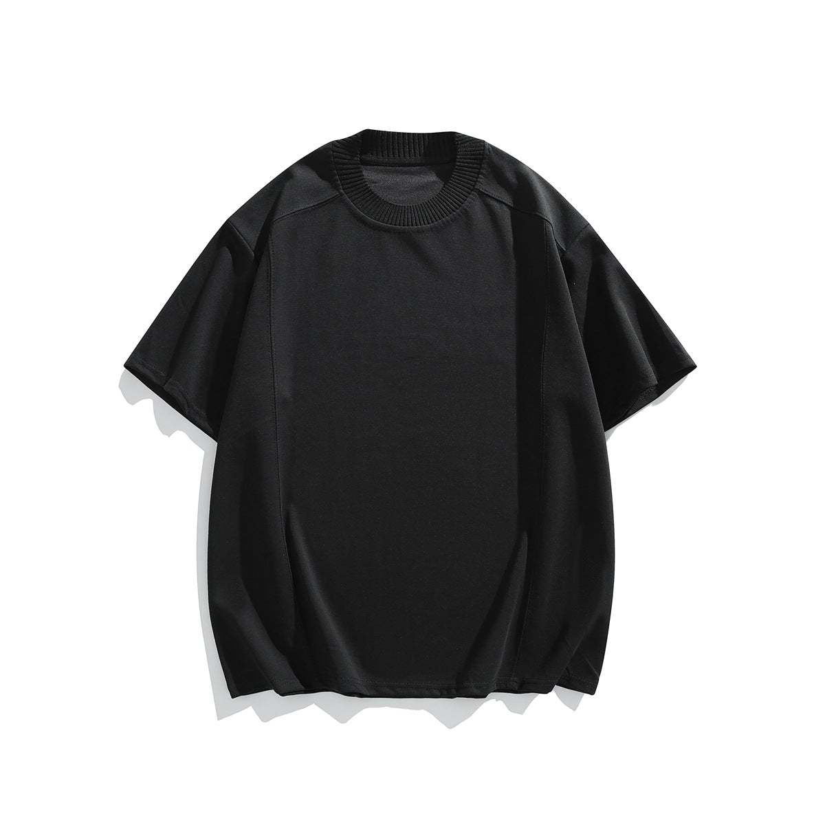 Black short-sleeve crew-neck T-shirt with ribbed collar and front seam lines, flat lay on white background