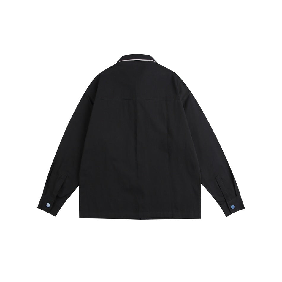 Back view of a black long-sleeved button-up shirt with a yoke seam and blue cuff buttons.