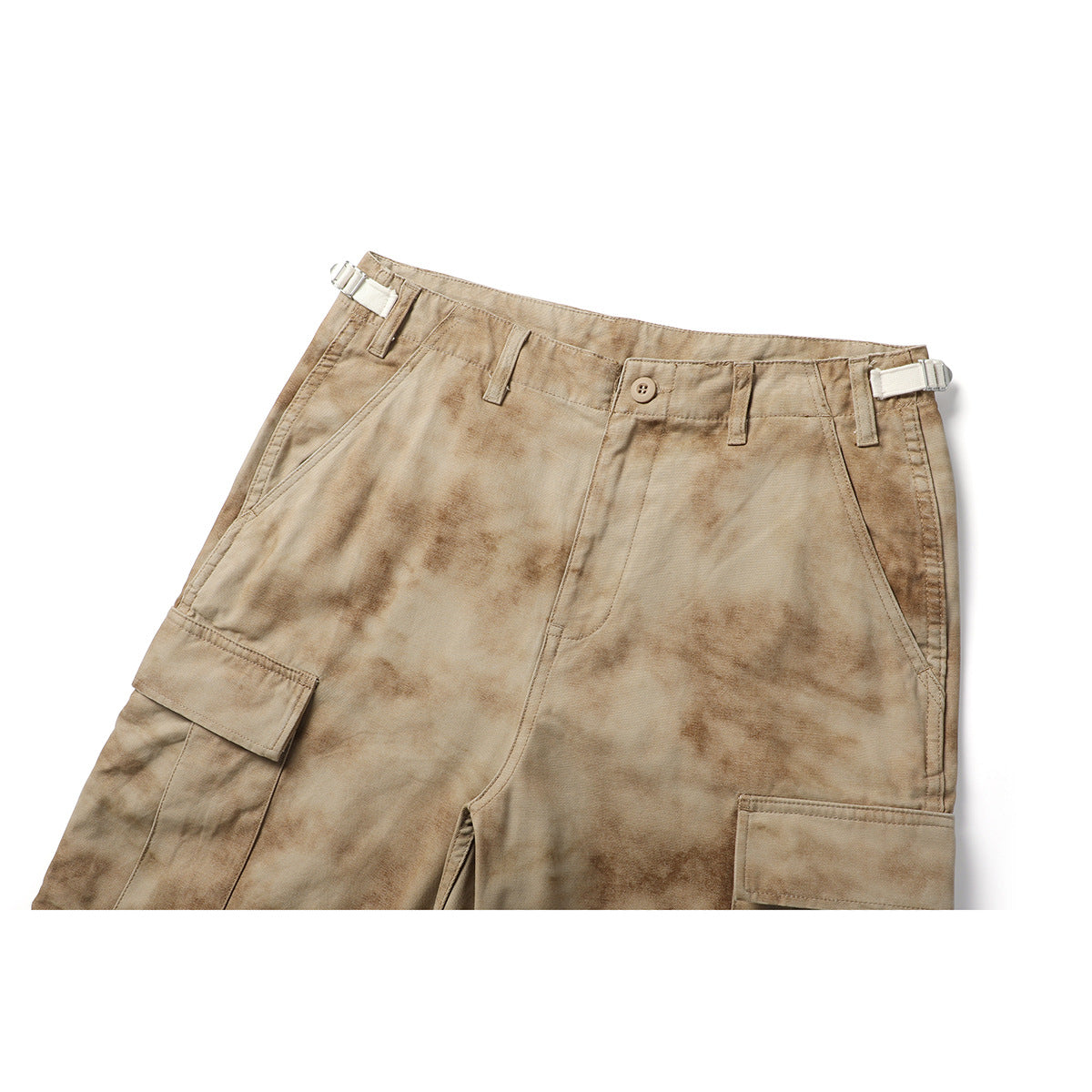 Cropped front view of tan mottled cargo shorts with a button waist, side adjusters, and large flap pockets.
