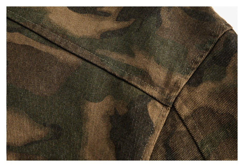 Close-up of brown and dark green camouflage fabric with a diagonal stitched seam.