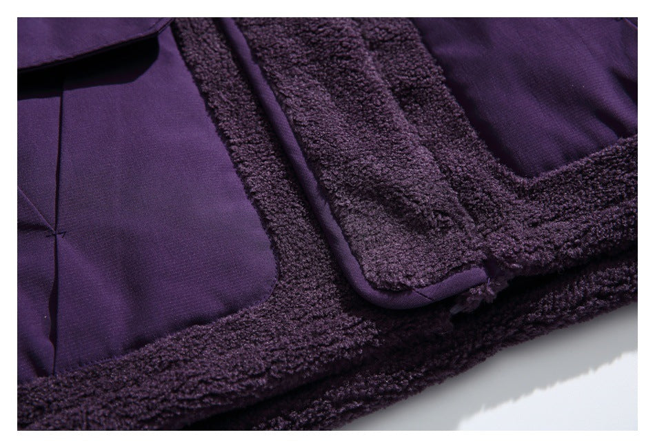 Close-up of a deep purple jacket pocket bordered by fuzzy trim and matching piping.
