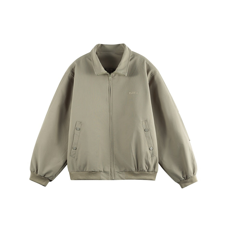 Sage green zip-front jacket with spread collar, ribbed cuffs and hem, and snap tabs at the side pockets, flat front view