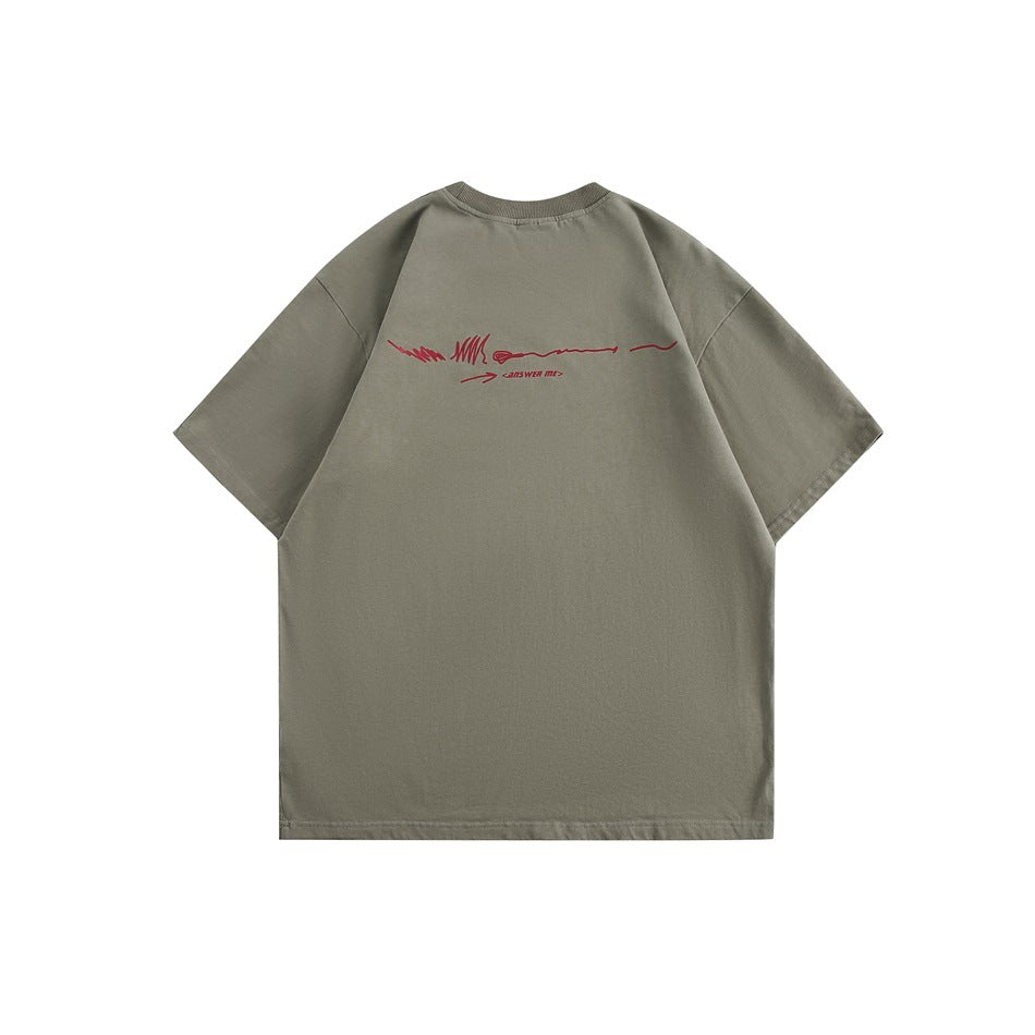 Back view of an oversized muted gray-green T-shirt with a small red graphic across the upper back.