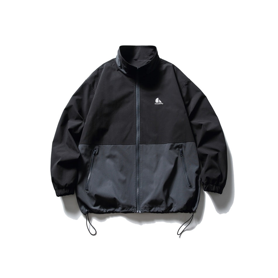 Black and charcoal gray color-block stand-collar zip jacket, front flat view with zip pockets and drawcord hem