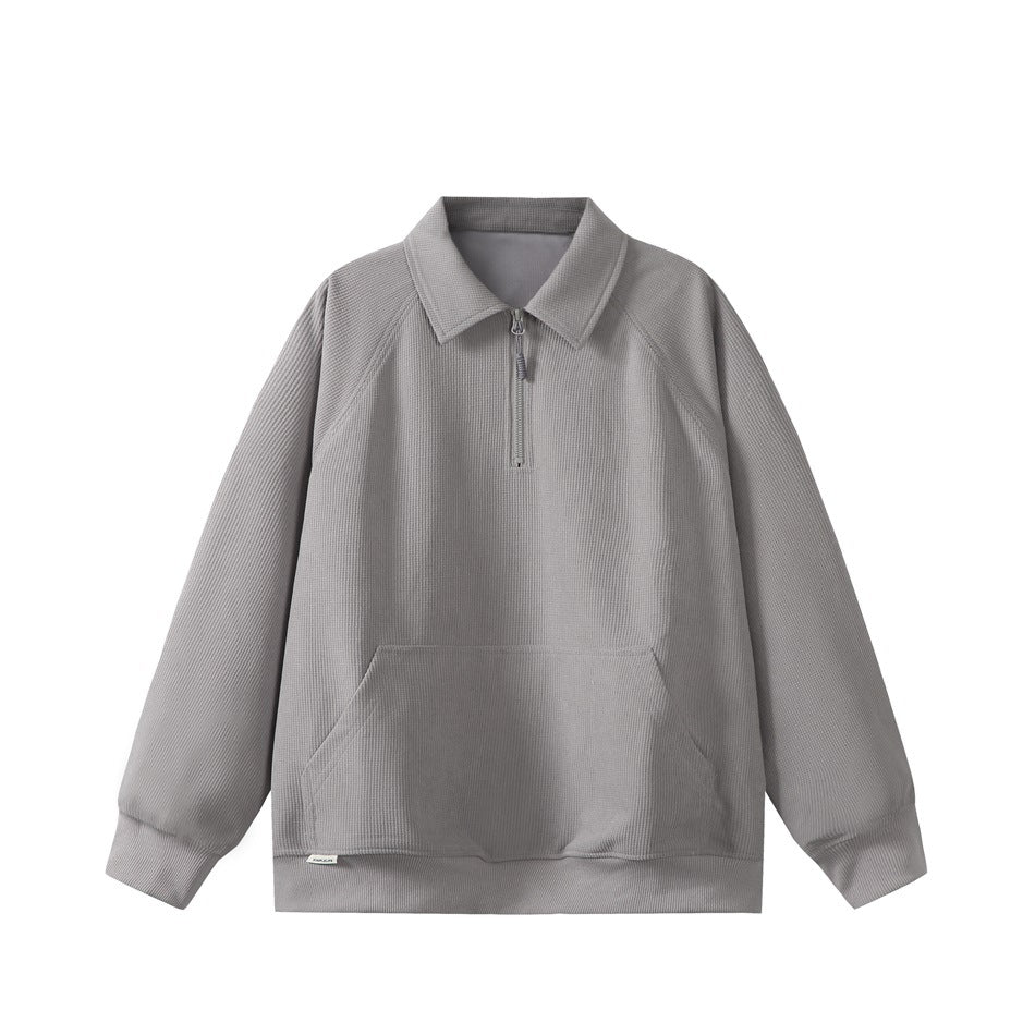 Gray waffle-knit quarter-zip sweatshirt with polo collar, raglan sleeves and front kangaroo pocket, flat lay