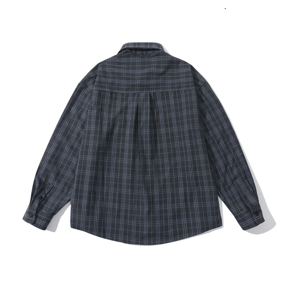 Back view of dark charcoal plaid long-sleeve shirt with yoke, center pleat and buttoned cuffs