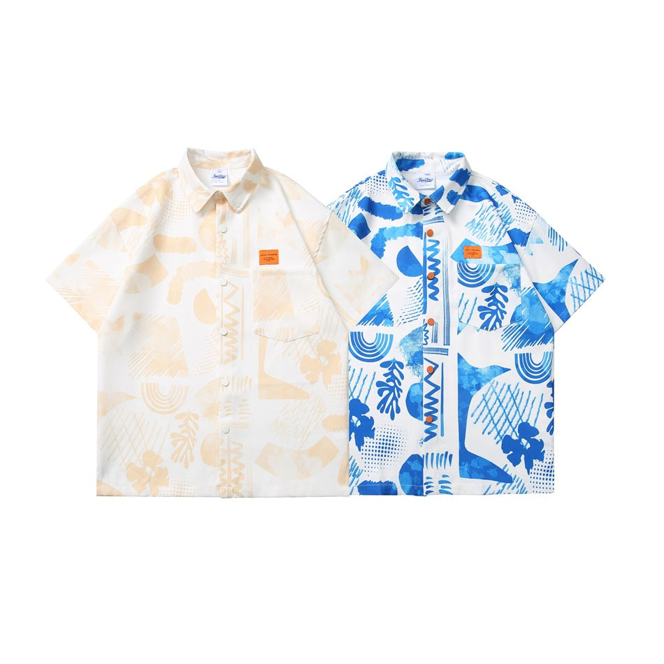 Two short-sleeve collared shirts shown side by side: one cream and one white with blue abstract prints.
