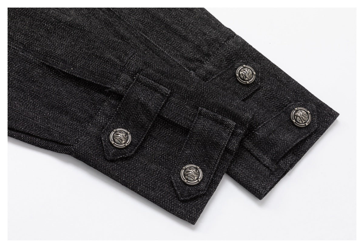 Close-up of black denim sleeve cuffs with overlapping buttoned tabs and embossed metal buttons.