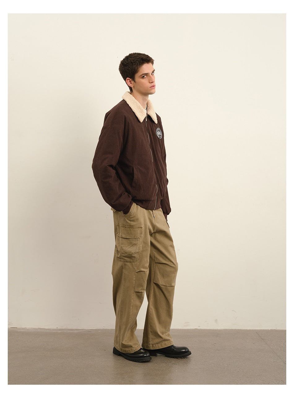 Side view of a model wearing khaki cargo pants and a dark brown jacket with a cream collar.