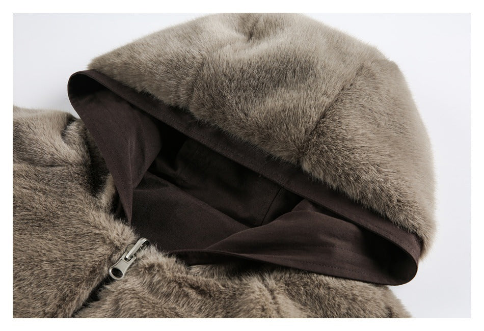 Close-up of a brown-gray faux-fur hood with dark lining and a visible zipper.