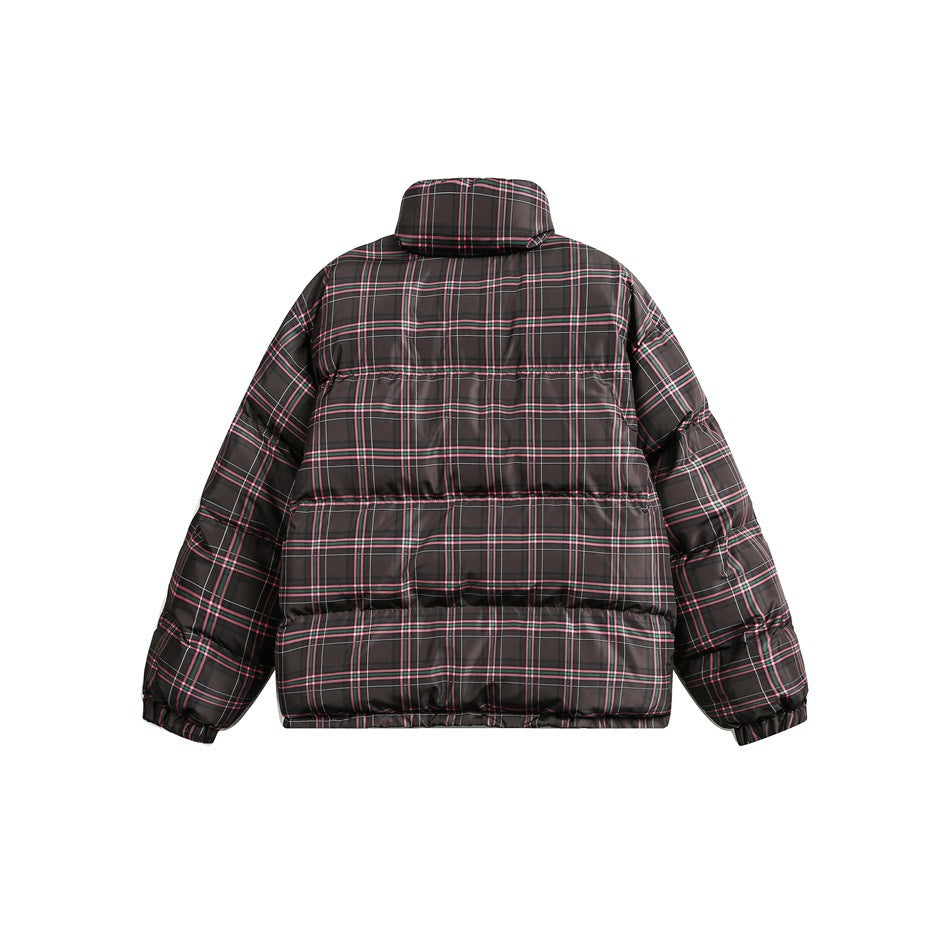 Back view of a dark puffer jacket with pink, green, and white plaid lines and a raised collar.
