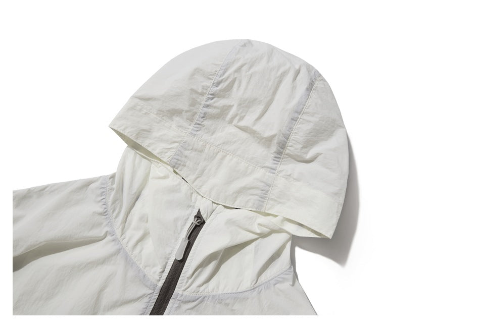 Close-up of the white jacket's hood, collar, and upper front zipper.