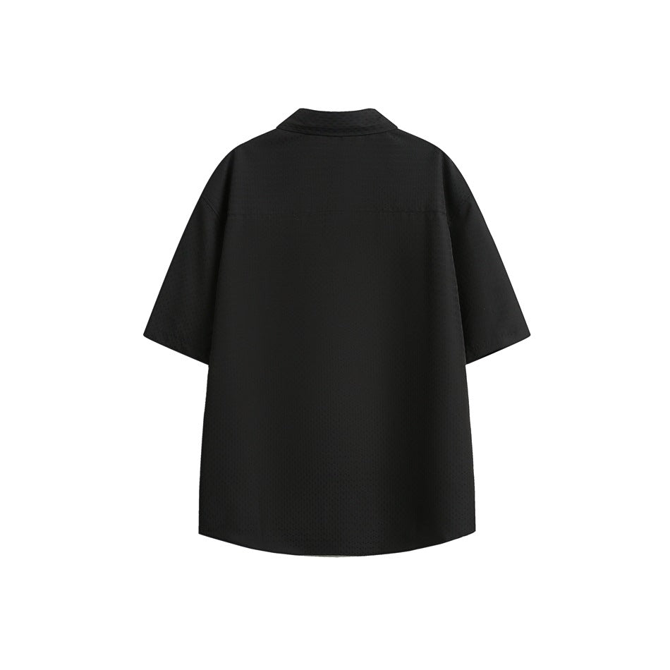 Back view of a black short-sleeve button-up shirt with a pointed collar and straight yoke seam.