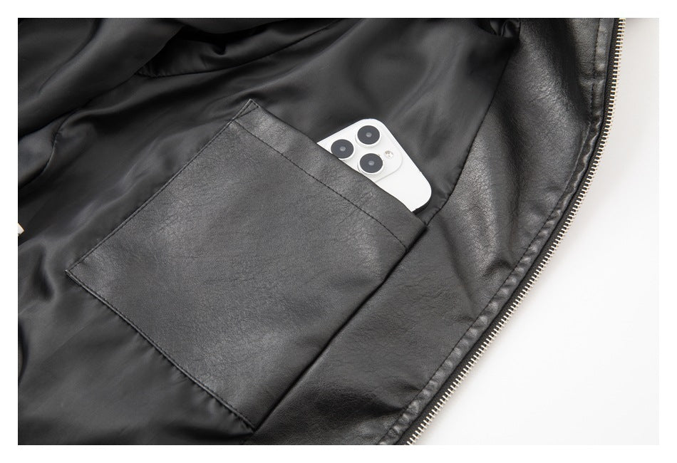 Inside view of a black jacket showing a large pocket holding a white smartphone.