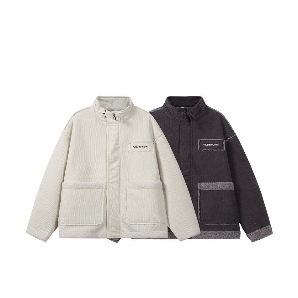 Two corduroy jackets shown from the front: one ivory and one charcoal, with stand collars and large pockets.