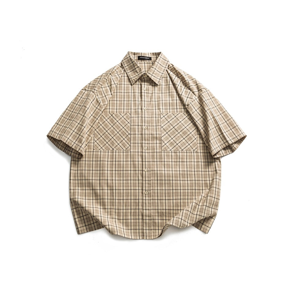 Apricot beige plaid short-sleeve button-up shirt with two chest patch pockets, flat lay on white background
