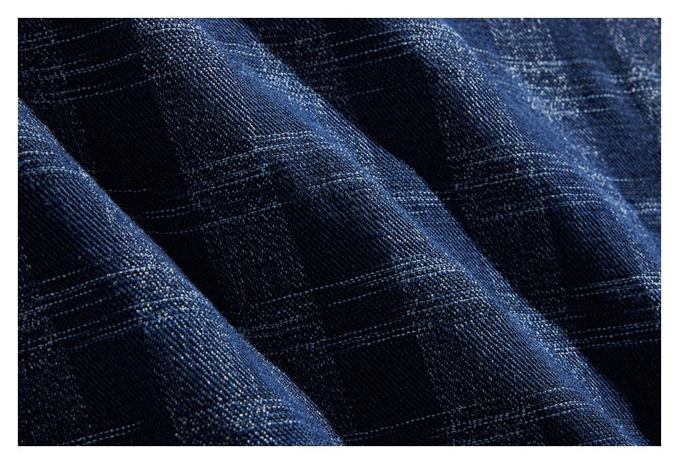 Close-up showing the dark blue plaid fabric and its woven texture.