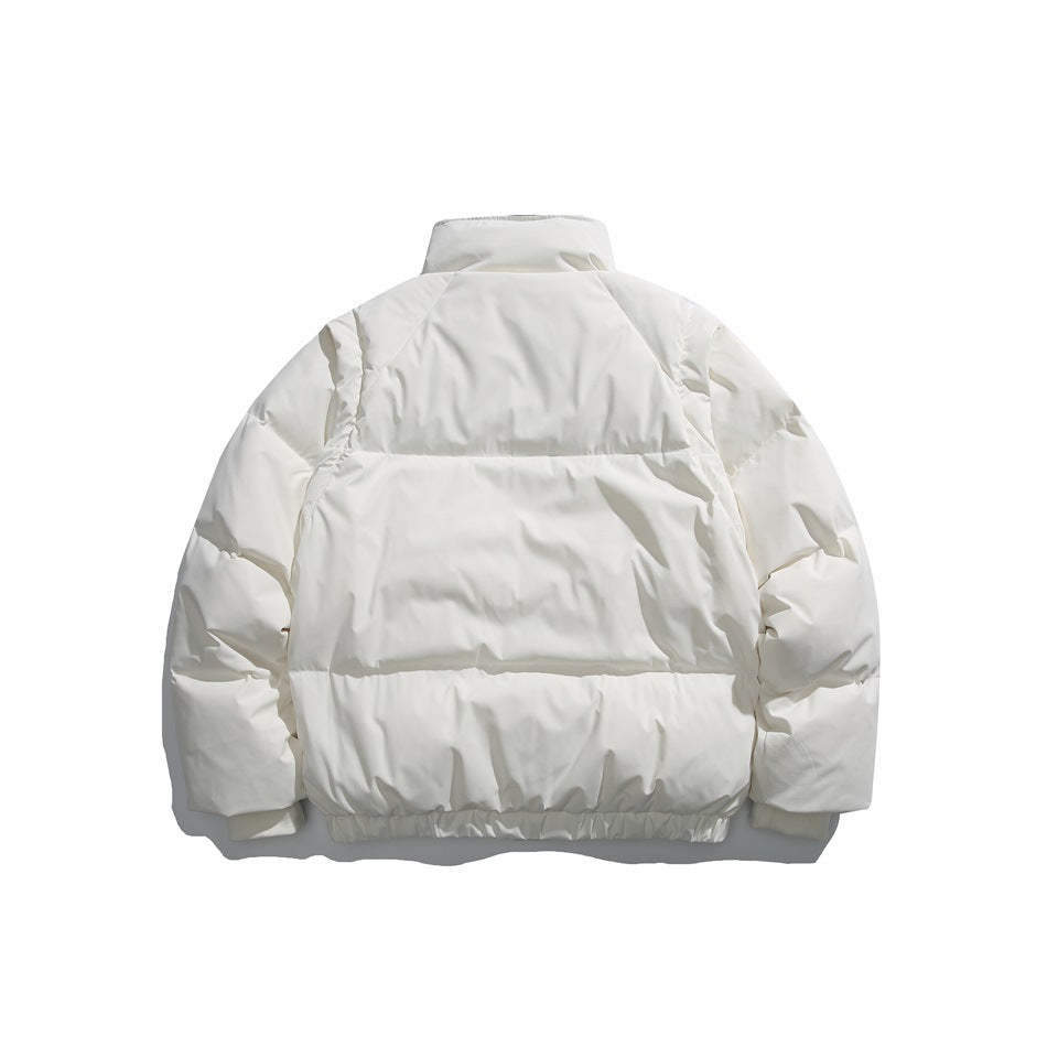 Back view of an ivory puffer jacket with a high collar, long sleeves, and horizontal quilted panels.