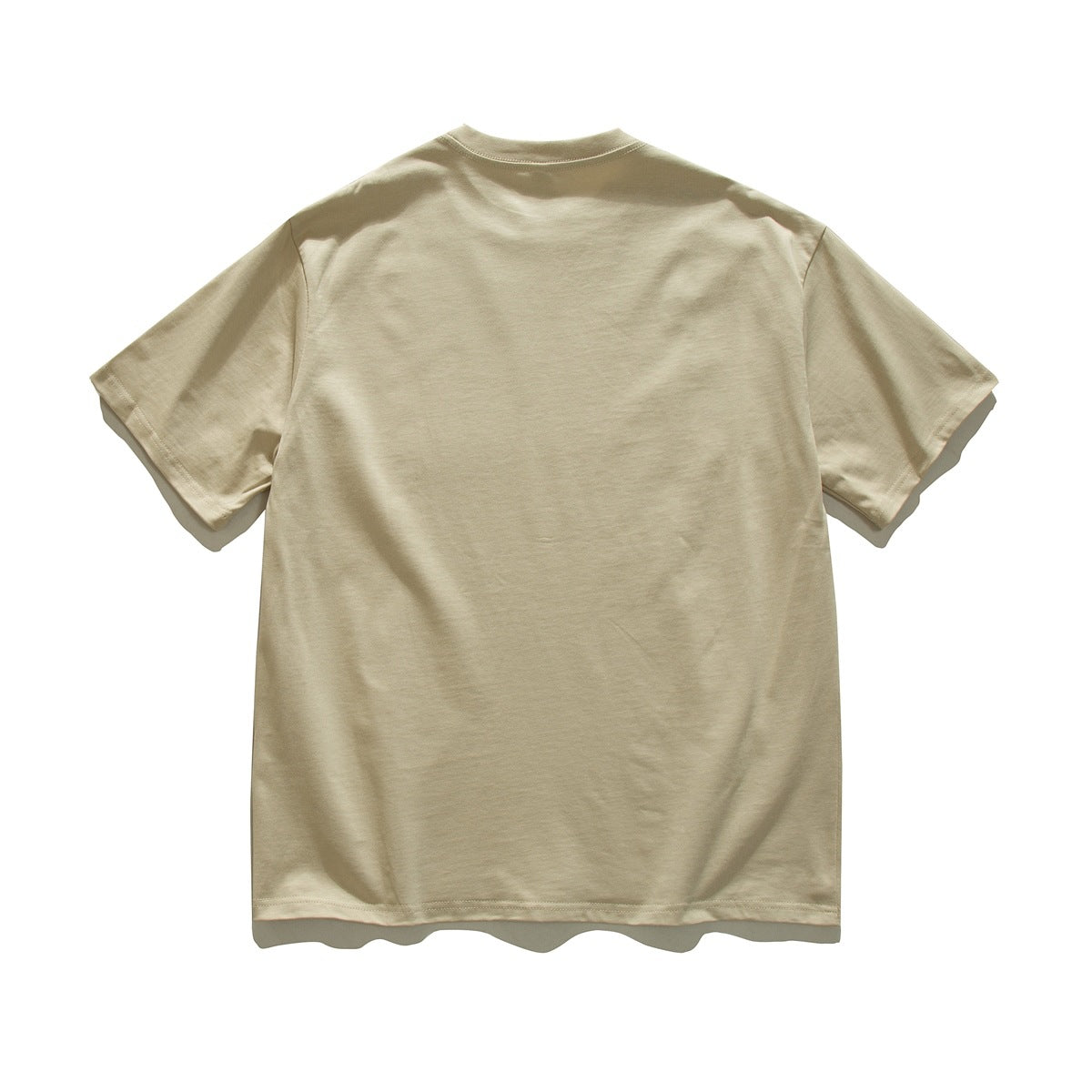 Back view of a plain beige short-sleeve crew-neck T-shirt laid flat on a white background.