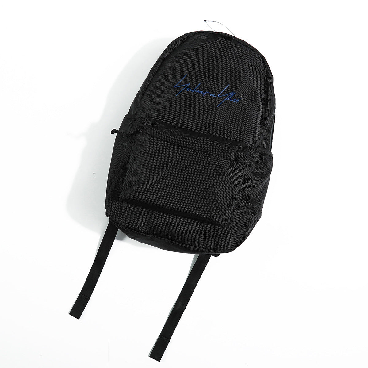 Black backpack flat lay, front view, with blue script embroidery and a zippered front pocket