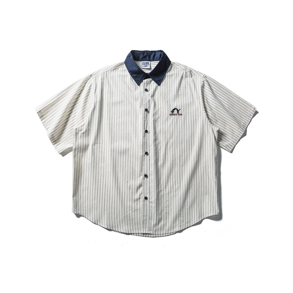 Off-white striped short-sleeve button-up shirt with navy collar and buttons, flat front view