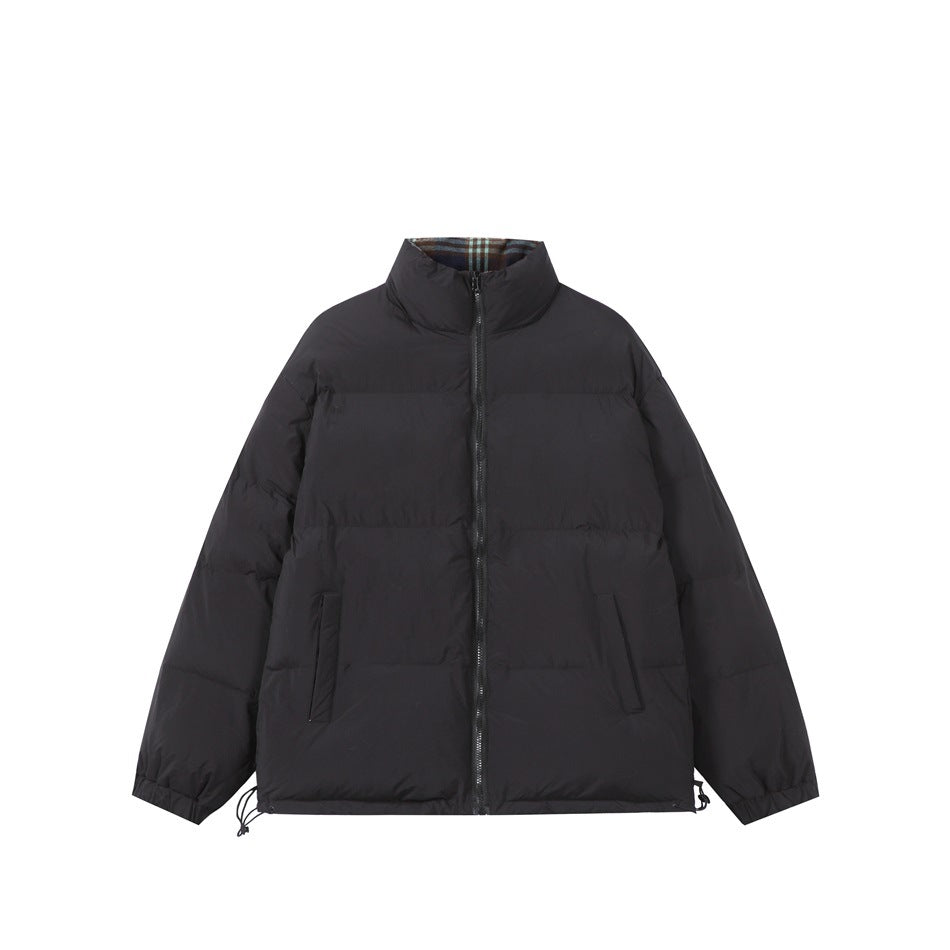 Black quilted stand-collar jacket with front zipper, slanted pockets and plaid lining at the collar, flat lay