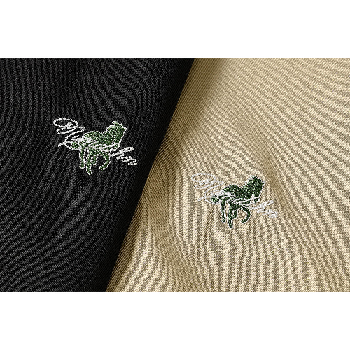 Close-up of matching green-and-white embroidered motifs on black and tan jacket fabric.