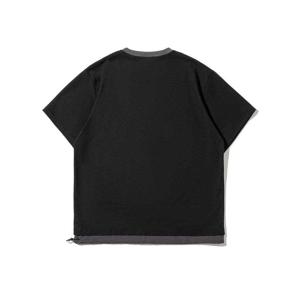 Back view of a black short-sleeve T-shirt with gray neck trim and a contrasting hem panel.