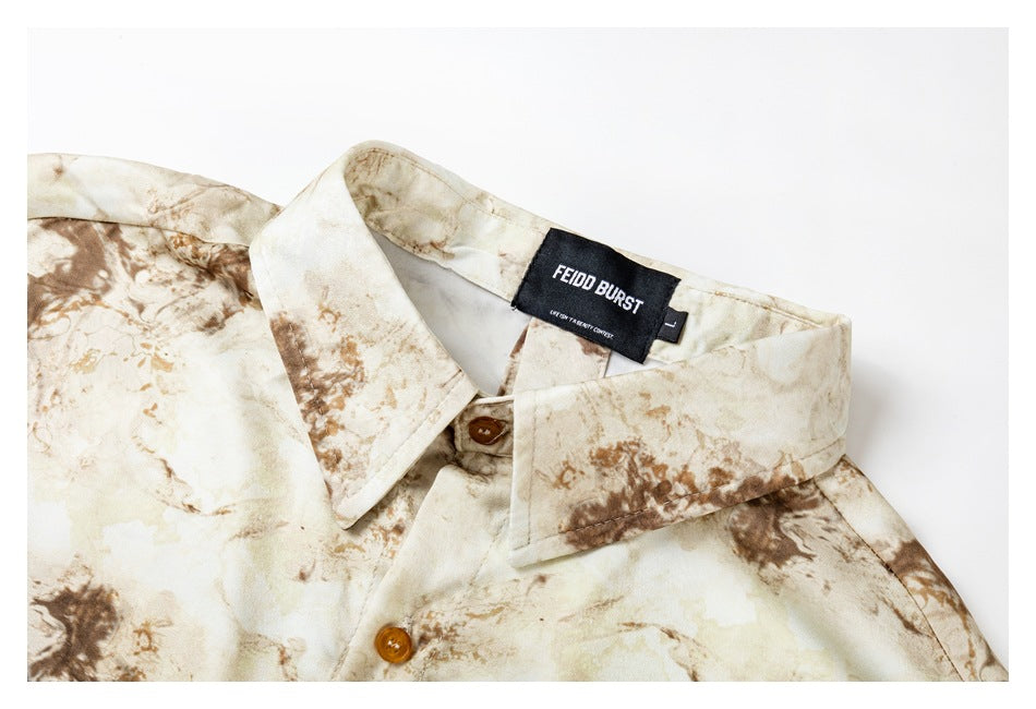 Close-up of the shirt collar, brown buttons, marbled print, and sewn-in black brand and size labels.