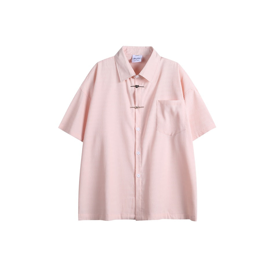 Pink short-sleeve button-front shirt with chest pocket and two metal heart clasps, flat front view