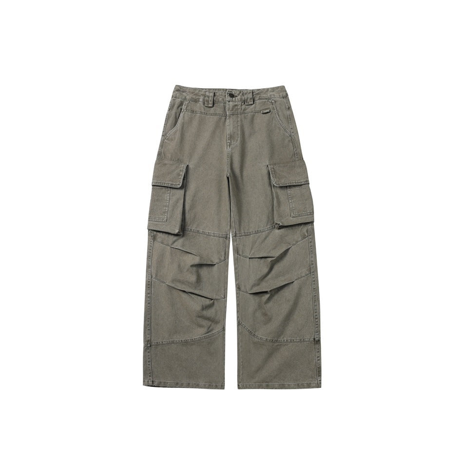 Front view of gray-olive wide-leg cargo pants with large flap pockets and curved knee panel seams.